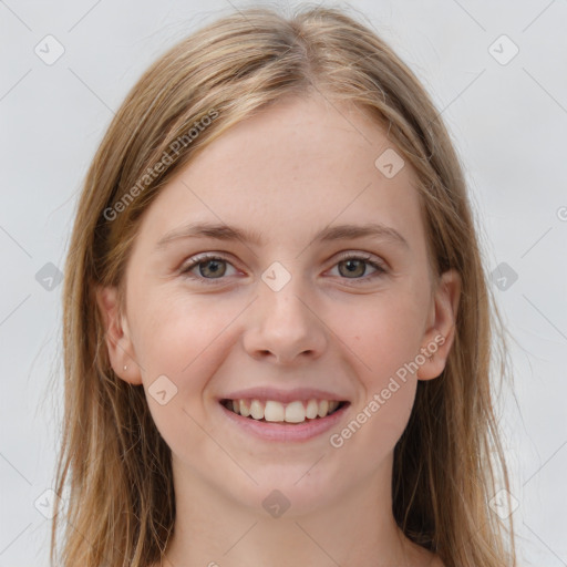 Joyful white young-adult female with long  brown hair and grey eyes