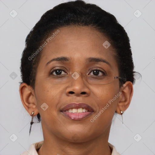 Joyful black adult female with short  brown hair and brown eyes