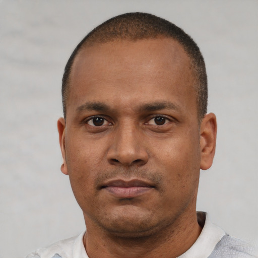 Neutral latino young-adult male with short  brown hair and brown eyes