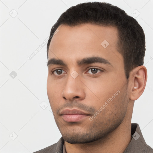 Neutral latino young-adult male with short  black hair and brown eyes