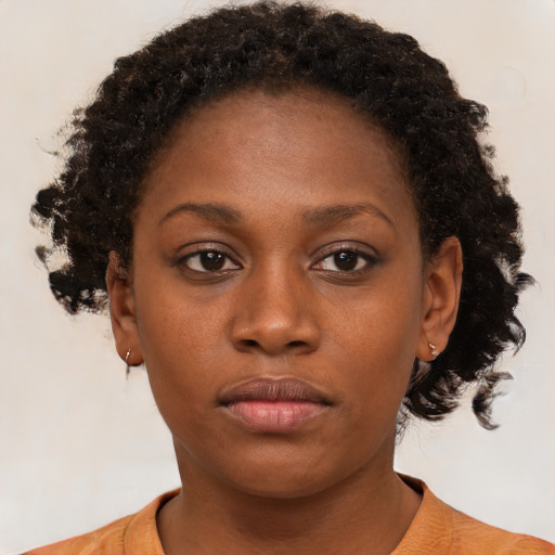 Neutral black young-adult female with short  brown hair and brown eyes