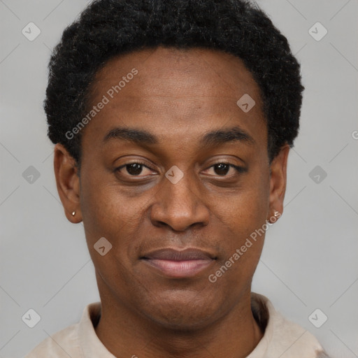 Joyful black young-adult male with short  black hair and brown eyes