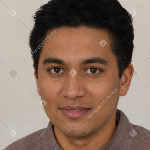 Joyful latino young-adult male with short  brown hair and brown eyes