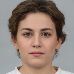 Neutral white young-adult female with medium  brown hair and brown eyes