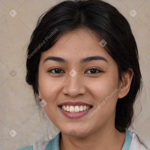 Joyful asian young-adult female with medium  brown hair and brown eyes