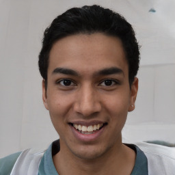 Joyful white young-adult male with short  black hair and brown eyes