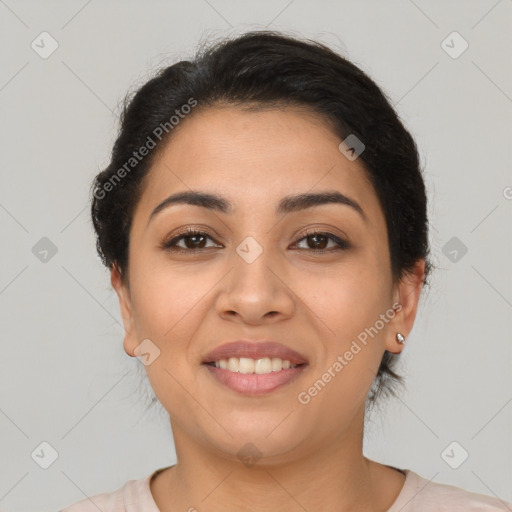 Joyful latino young-adult female with medium  brown hair and brown eyes