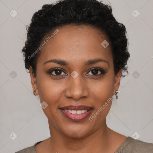 Joyful black young-adult female with short  black hair and brown eyes