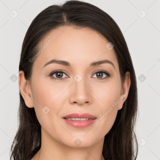 Joyful white young-adult female with long  brown hair and brown eyes