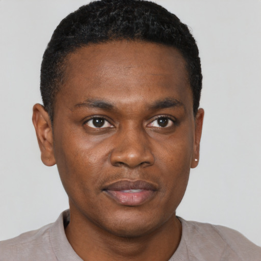 Neutral black young-adult male with short  black hair and brown eyes