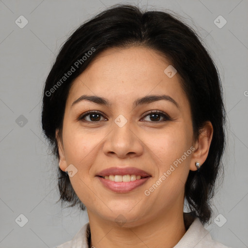 Joyful latino adult female with medium  brown hair and brown eyes