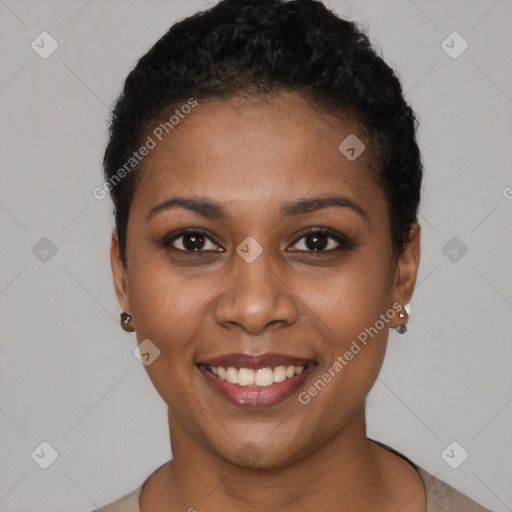 Joyful black young-adult female with short  black hair and brown eyes