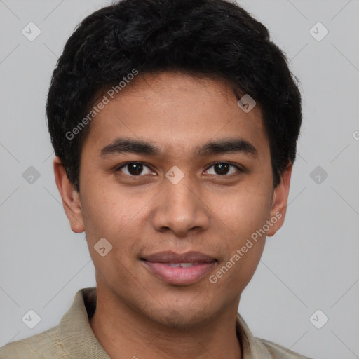 Joyful latino young-adult male with short  brown hair and brown eyes