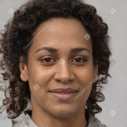 Joyful black adult female with medium  brown hair and brown eyes