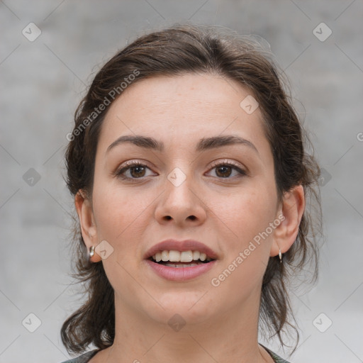 Joyful white young-adult female with medium  brown hair and brown eyes