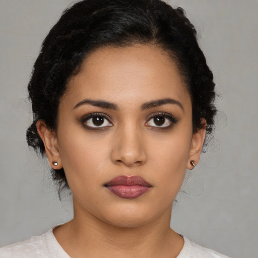 Neutral latino young-adult female with medium  black hair and brown eyes