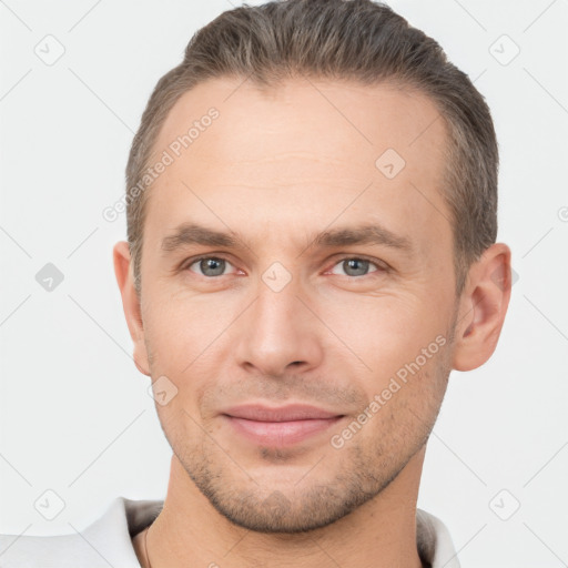 Joyful white young-adult male with short  brown hair and brown eyes