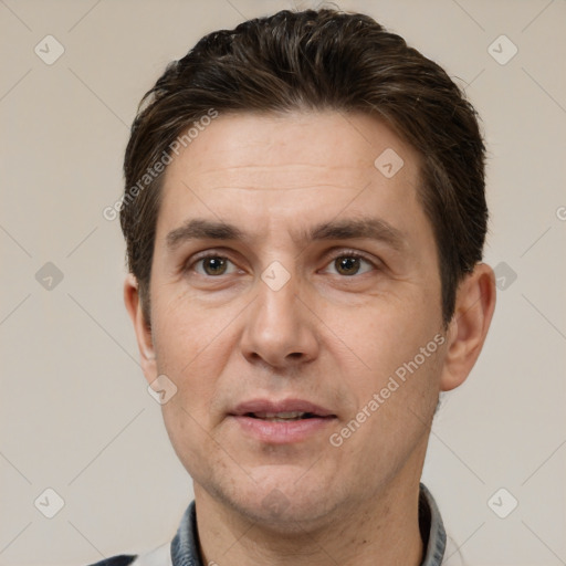 Joyful white adult male with short  brown hair and brown eyes