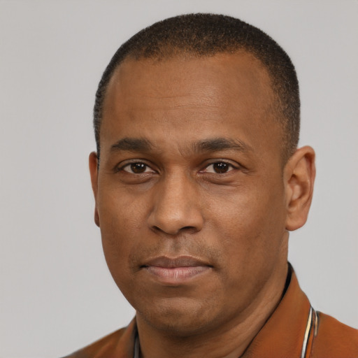 Neutral black young-adult male with short  brown hair and brown eyes