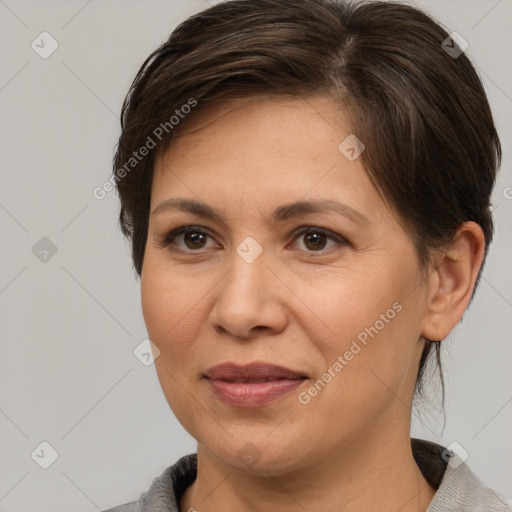 Joyful white adult female with medium  brown hair and brown eyes