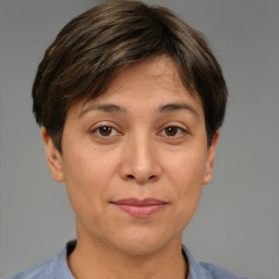 Joyful white adult female with short  brown hair and brown eyes