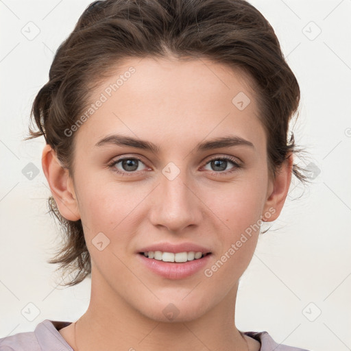 Joyful white young-adult female with medium  brown hair and grey eyes