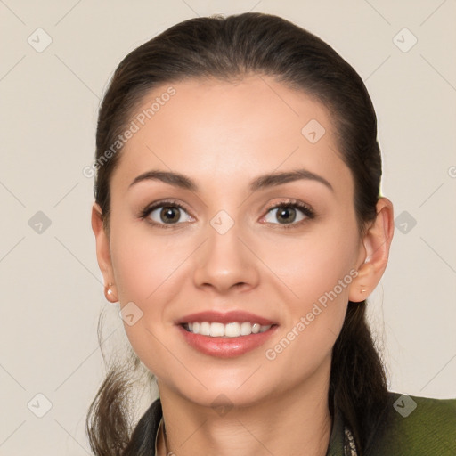 Joyful white young-adult female with long  brown hair and brown eyes