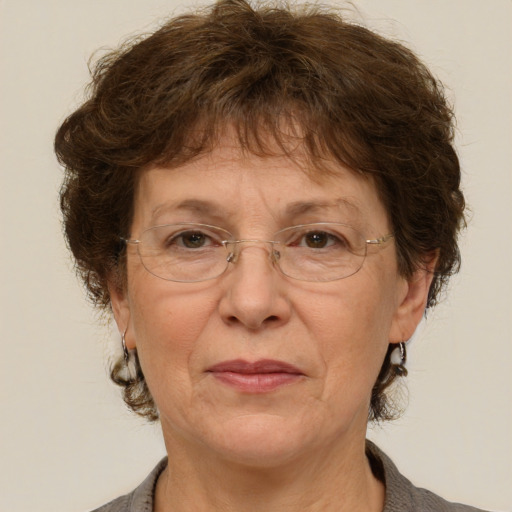 Joyful white middle-aged female with short  brown hair and brown eyes