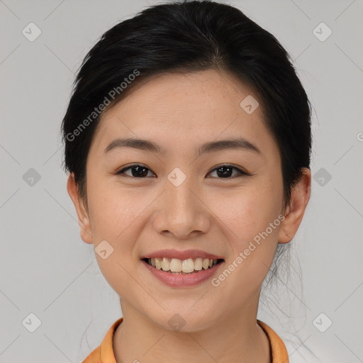 Joyful asian young-adult female with short  brown hair and brown eyes