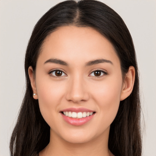 Joyful white young-adult female with long  brown hair and brown eyes