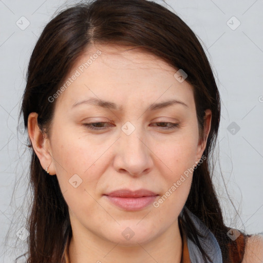 Joyful white adult female with medium  brown hair and brown eyes