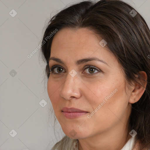 Joyful white adult female with medium  brown hair and brown eyes