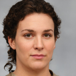 Joyful white young-adult female with medium  brown hair and green eyes