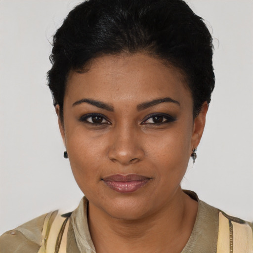 Joyful latino young-adult female with short  black hair and brown eyes