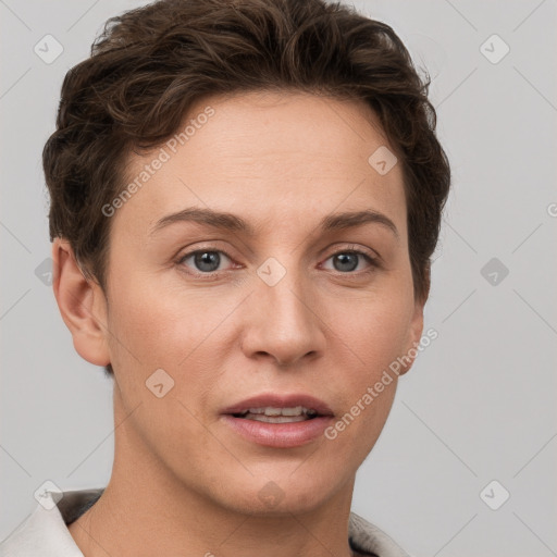 Joyful white young-adult female with short  brown hair and grey eyes