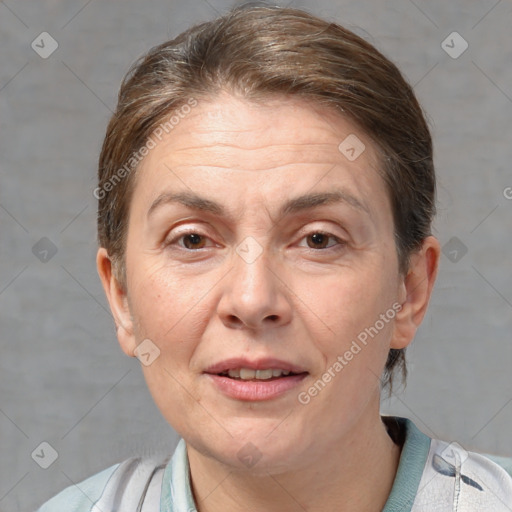 Joyful white adult female with short  brown hair and brown eyes