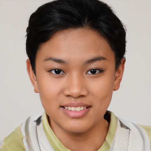 Joyful asian child female with short  brown hair and brown eyes