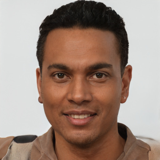 Joyful white young-adult male with short  black hair and brown eyes