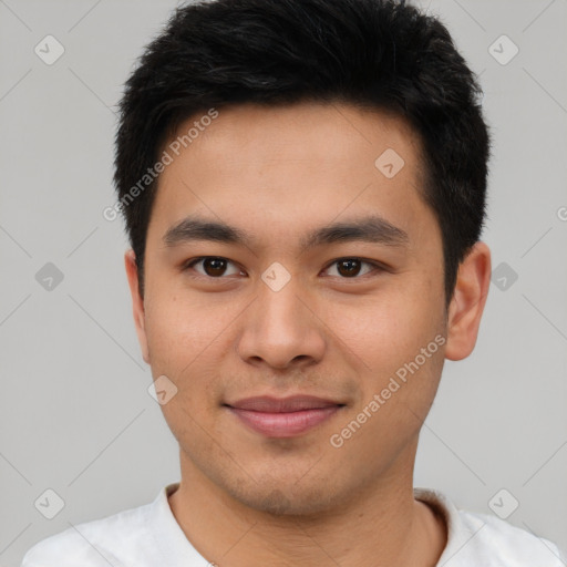 Joyful asian young-adult male with short  brown hair and brown eyes