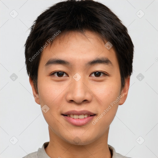 Joyful asian young-adult male with short  brown hair and brown eyes