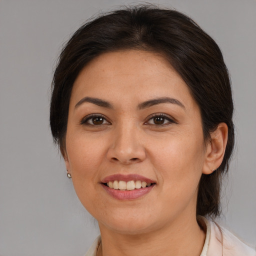 Joyful white adult female with medium  brown hair and brown eyes