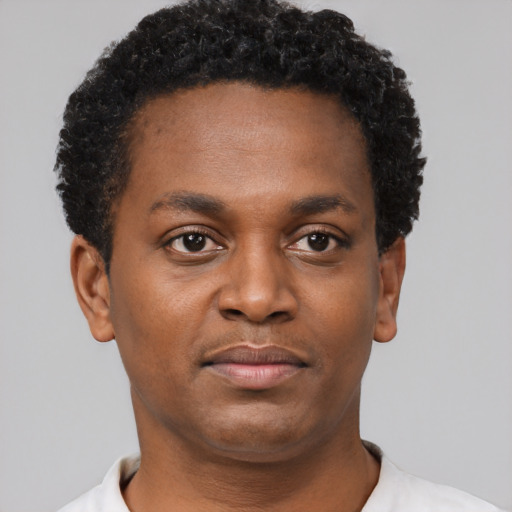 Neutral black young-adult male with short  black hair and brown eyes