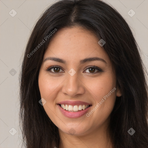 Joyful latino young-adult female with long  brown hair and brown eyes