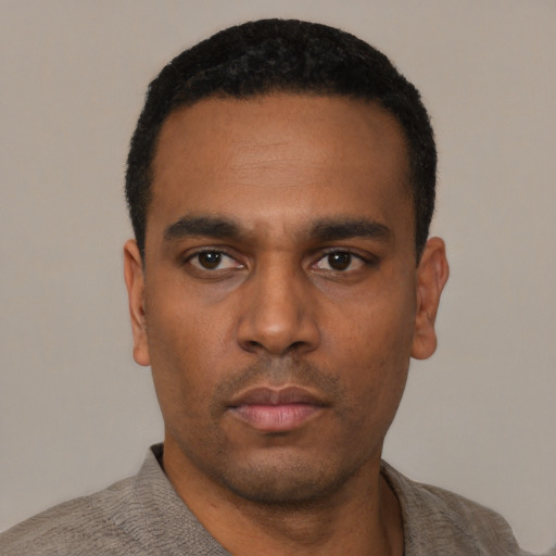 Neutral black young-adult male with short  black hair and brown eyes