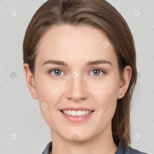 Joyful white young-adult female with long  brown hair and grey eyes