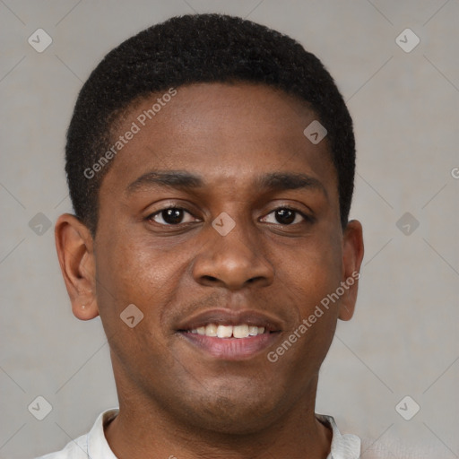 Joyful black young-adult male with short  brown hair and brown eyes