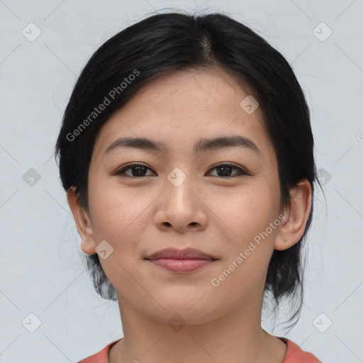 Joyful asian young-adult female with medium  black hair and brown eyes