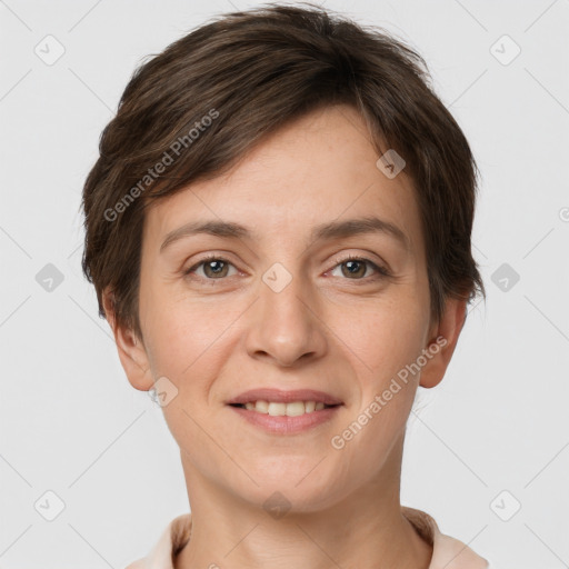 Joyful white young-adult female with short  brown hair and grey eyes