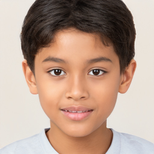 Joyful white child male with short  brown hair and brown eyes