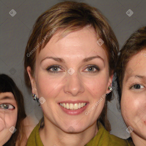 Joyful white adult female with medium  brown hair and green eyes